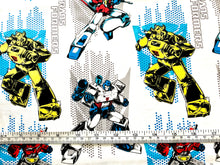 Load image into Gallery viewer, Transformers Logos - White Fabric - 1/2 Meter - Cotton Fabric
